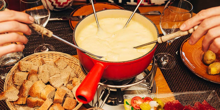 Savouring fondue in the medieval town of Gruyères
